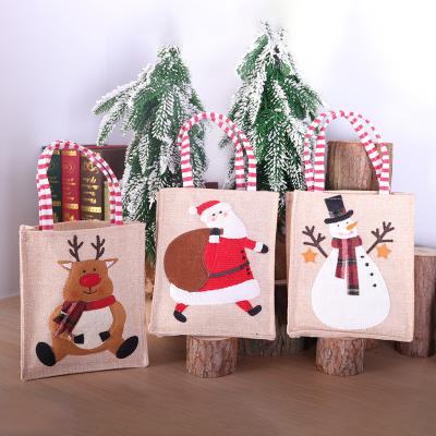 China 2021 Christmas Home Decor Jute Gift Bag Christamas With Handle Xmas Storage Bags For Kids Gifts Xmas Decorations for sale