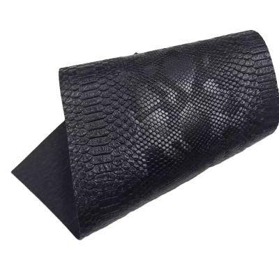 China Abrasion-resistant factory direct sale snake embossed leather roll for bags making rexine faux leather leather fabric for sale