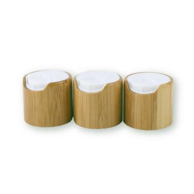 China Non Puddle 24/410 Wood Grain Bamboo Press Cap Cover Cosmetic Bottle Plastic Disc Shampoo Top Caps for sale