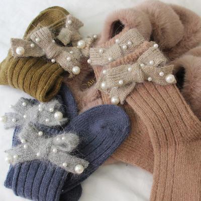 China Good Quality Winter Woolen Thick Warm Socks Appropriate Prices QUICK DRY Pearl Bowknot Women Winter Socks Rabbit Fur Winter Socks for sale