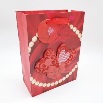 China M Wholesale Luxury Recyclable Purse Shopping Gift Packing 3D Heart Printed Paper Bag With Ribbon Handle for sale