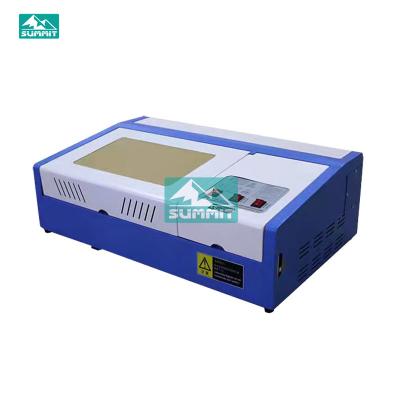 China Water Cooled Summit 3020 CO2 High Quality Laser Engraving Machine for sale