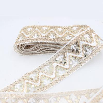 China Luxury Wholesale 5cm Width Design Wavy Sequins Lace Up African Embroidered Trim For Diy Dress for sale