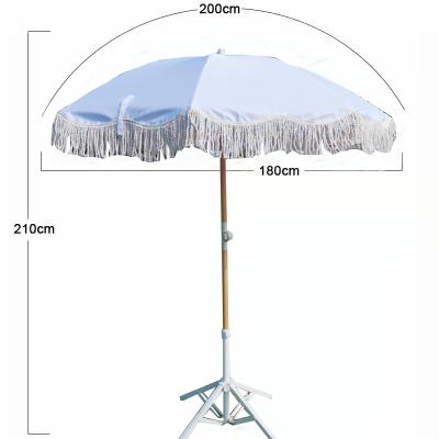 China CLASSIC hot sale pure white wavy edge to shelter The Sun beach umbrellas with tassels for sale