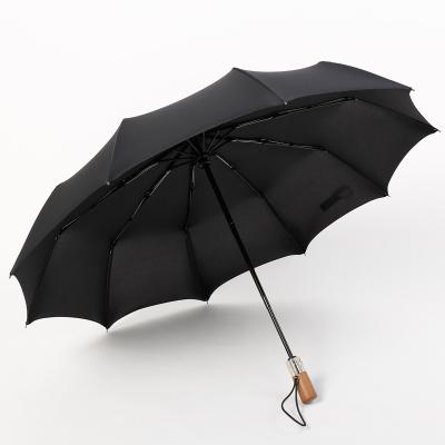 China Fashion 3 Folds Black Wooden Handle 10ribs Automatic Umbrella for sale