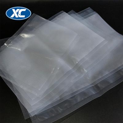 China Nylon Barrier Frozen Food Airtight Seal Embossed Cool Suction Squeeze Bag Plastic Transparent Packaging Bag for sale