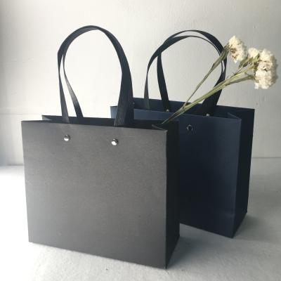 China Custom Luxury Matte Lamination Gifts Black Paper Shopping Bag Recyclable With Nylon Handles for sale