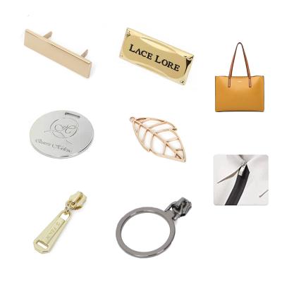 China Other Custom Metal Label Purse Hardware Metal Tags For Handbags And Clothing for sale