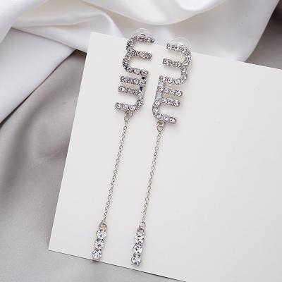 China FASHIONABLE Design Full Diamond M Letter Tassel Earrings Long Fashion Jewelry Fashion Stud Earrings for sale