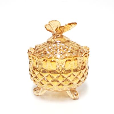 China Freshness Preservation Gold Plated Wholesale Candy Storage Glass Jars With Butterfly Shaped Lid for sale