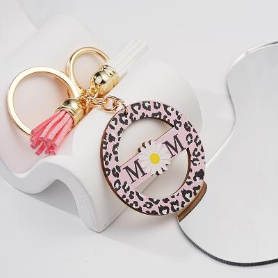 China Durable Hot selling hollowed out pink circular Mother's Day personalized small daisies key chain metal for sale