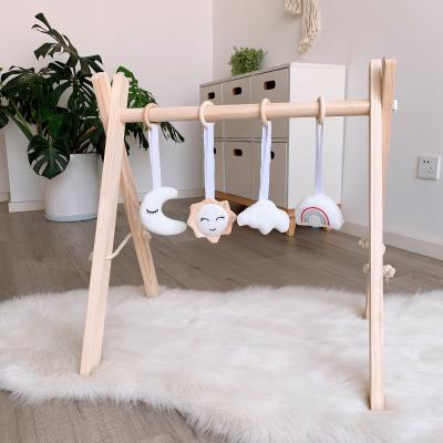 China Durable Nordic Design Wooden Baby Play Foldable Gym Hanging Bell Frame Activity Gym Toy for sale