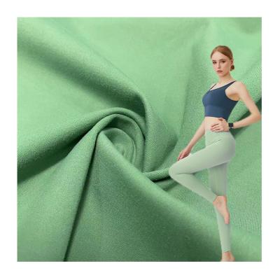 China Blackout Weft Knit Polyester Spandex 4 Way To Stretch Plain Jersey Fabric For Sportswear Yoga Leggings for sale