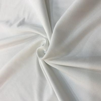 China Cheap Memory Polyester Knitted Fabric Rolls Packing T-shirt Comfortable Yummy Milk Silk Tank Top Fabrics for sale