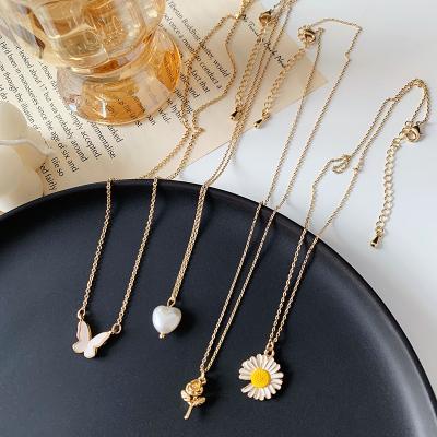 China Cute Exquisite Tasty Pearl Necklace Daisy Pendant Metal Rose Flower Butterfly Clavicle Chain for sale