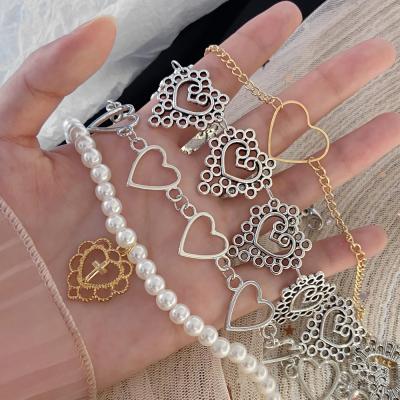 China Finetoo FASHIONABLE Fashion Heart Shape Choker Vintage Pearl Heart Tasty Hollow Necklace For Women Jewelry for sale