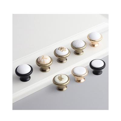 China New Design Furniture Handle Modern Black Gold Combination Single Hole Pull European Door Drawer Wardrobe Cabinet Ceramic Knobs for sale