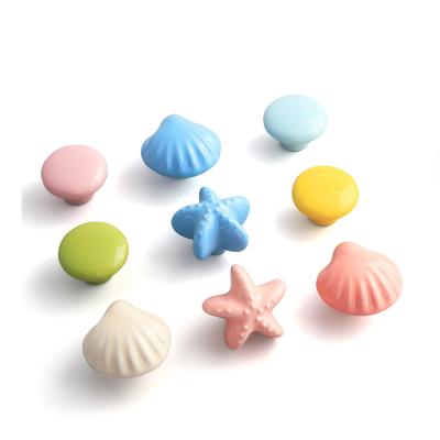 China Wholesale Ceramic Shell Shape Child Room Furniture Chinese Hardware Fashion Sideboard Door Knobs Desk Drawer Bedside Table Handles for sale