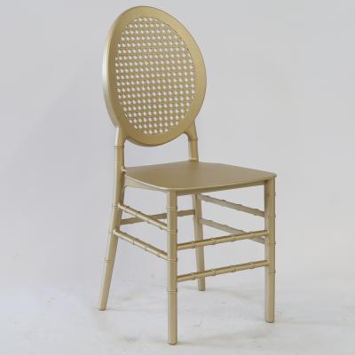 China Modern Gold Round Resin PP Plastic Gridding O Back Stacking Chair For Event for sale