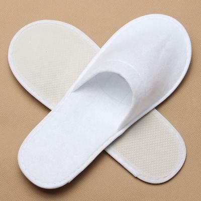 China Eco-friendly Exquisite Disposable Hotel Amenities Wholesale Single-Use House Slippers Unisex Flat Ladies Slippers for sale