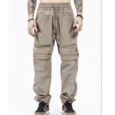 China New Anti-Wrinkle Trend Fashion Cargo Pants Men Solid Color Oversized Trouser Pants Drawstring Waist Utility Pockets Tactical Pants for sale