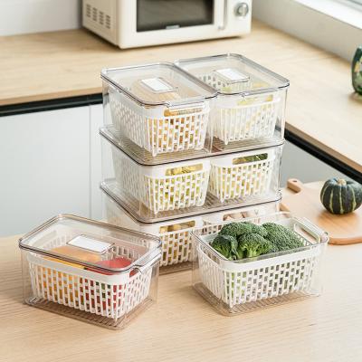 China Transparent Freshness Keeping Kitchen Drawer Refrigerator Organizer Food Storage Container With Filter Basket for sale