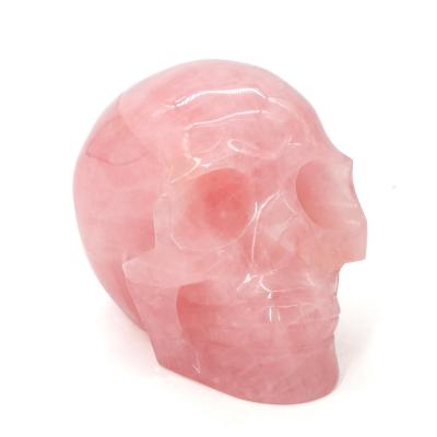 China China High Quality Natural Hand Carved Feng Shui Stone Folk Crafts Rose Quartz Crystal Skulls For Healing Gemstone Decoration for sale