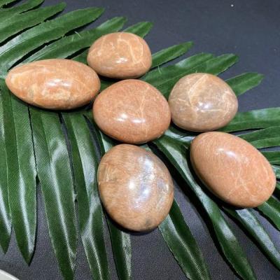 China China Wholesale Natural Stone Crystal Quartz Rough Stone Carved Crystal Gemstone Crafts Sunstone Palm for Feng shui decoration for sale