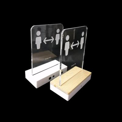 China Desktop Acrylic Magazine Display Stand Wooden Base Infrared LED Warning Sign Social Distancing Acrylic Stand With Sensor for sale