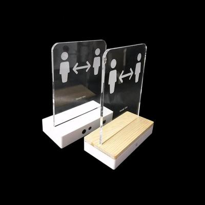 China Eco-friendly Infrared Social Distancing LED Wooden Base Warning Sign Acrylic Stand With Sensor for sale