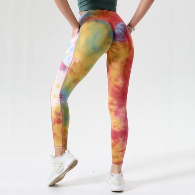 China Sports Tight High Waist Lift Breathable Women Yoga Pants Tight Pockets Naked Peach Chrysanthemum Pants Tie Dye Leggings for sale