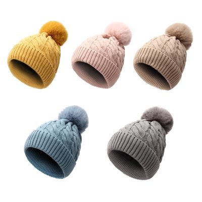 China Large COMMON Fur Pom Pom Hats Knit Beanie Hats Faux Ski Cap Bobble Skull Cap for Winter Beanie Hats for Women for sale