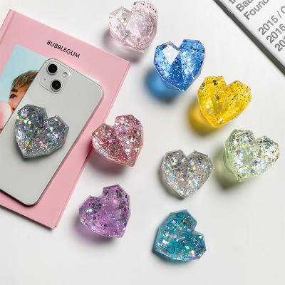 China New Design Bling Adjustable Glitter Mobile Phone Holder 3D Laser Heart Retractable Style Crystal Transparent Holder Stand for sale