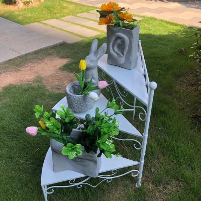 China Three Layers Modern Wholesale Rotating White Flower Stand For Garden Display for sale