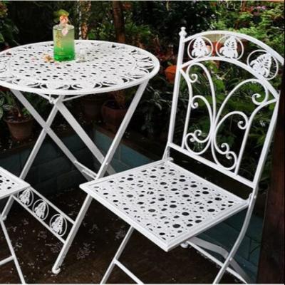 China Outdoor Farmhouse Furniture Dining Mental Chair And Waterproof Rattan Chair Patio Table Set for sale