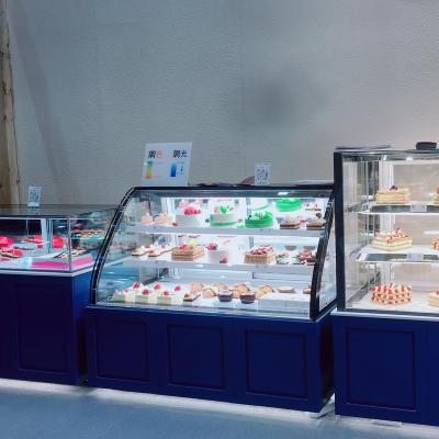 China Single-temperature factory direct transparent curved glass cake display fridge refrigerator other snack machines for sale