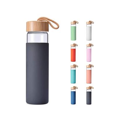 China Sustainable Hot Selling Lead Free Custom Printing Bamboo Lid With Rope Borosilicate Glass Reusable Water Bottle for sale