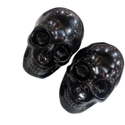 China China Wholesale Porcelain Crystal Skulls Hand Polished Obsidian Carved Crystal Skulls For Decoration for sale