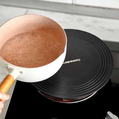 China Disposable Round Kitchen Heat Conduction Dish Gas Stove Top Absorbing Kitchen Stove Accessories 3088 for sale