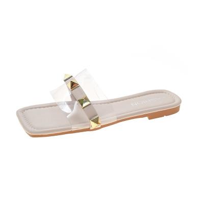 China 2021 fashion trend women's sandals and slippers external slippers summer rivet slippers heel line one bottom flat bottom for sale