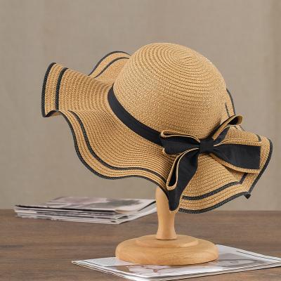 China New Character Design Summer Sun Beach Ladies Vacation Women's Wide Brim Soft Straw Hat for sale