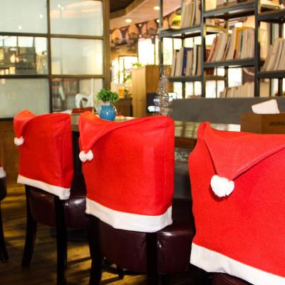 China Soft Touch Feeling Christmas Hat Chair Cover Ornament Hotel Restaurant Holiday Theme Decorations Chairs for sale