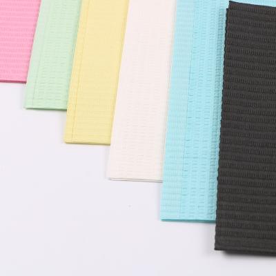 China Dental regional dental bibs made of white yellow pink green orange purple and other wood pulp and PE film for sale