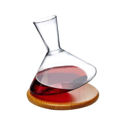 China Sustainable Lead-Free Crystal Rolling  360 Rotating Tumbler Design Red Wine Breather Carafe with Wooden base Accessories for sale