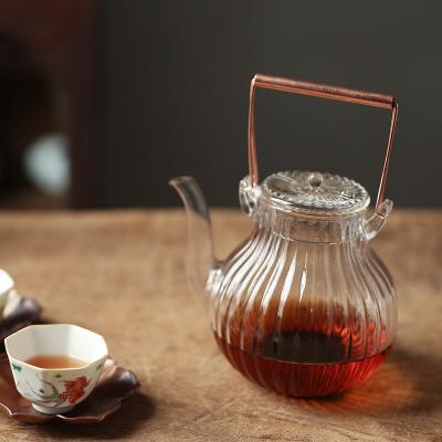 China Viable Glass Teapot Set Theiere Tetera Heat Resistant Glass Teapots With Lid And Glass Cooper Handle for sale