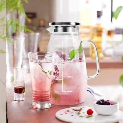 China Sustainable High Borosilicate Glass Water Pitcher With Stainless Steel Lid 2000ML For Home Use for sale