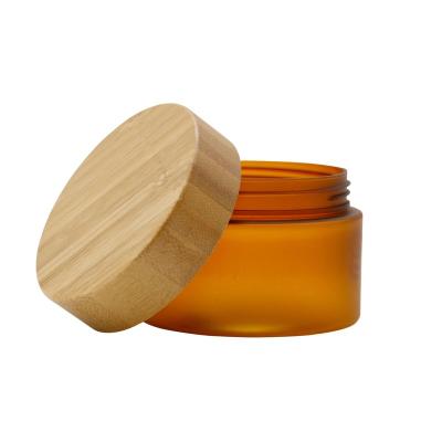 China Eco-Friendly Cosmetic Amber Glass Jar For Cream With Bamboo Lid For 10ml 20ml 30ml 50ml 100ml Customized for sale