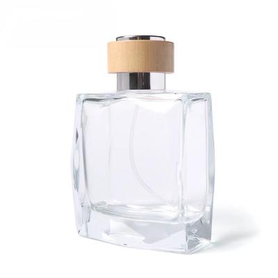 China Wholesale Cosmetic Perfume Bottle Eco - Friendly Thick Bottom Glass Netting With Wooden Cap for sale