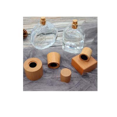 China Perfume Glass Bottle New Product Cheap Wood Perfume Material Natural Wood Cap for sale