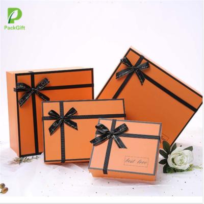 China Recycled Materials Customized Orange Cardboard Paper Lid And Base Gift Box For Perfume Packaging for sale